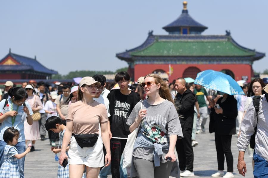 Family members visiting a cultural site in China for a short stay
