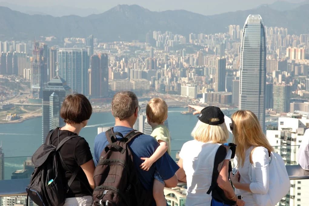 Family looking across a Chinese city during a long-term stay