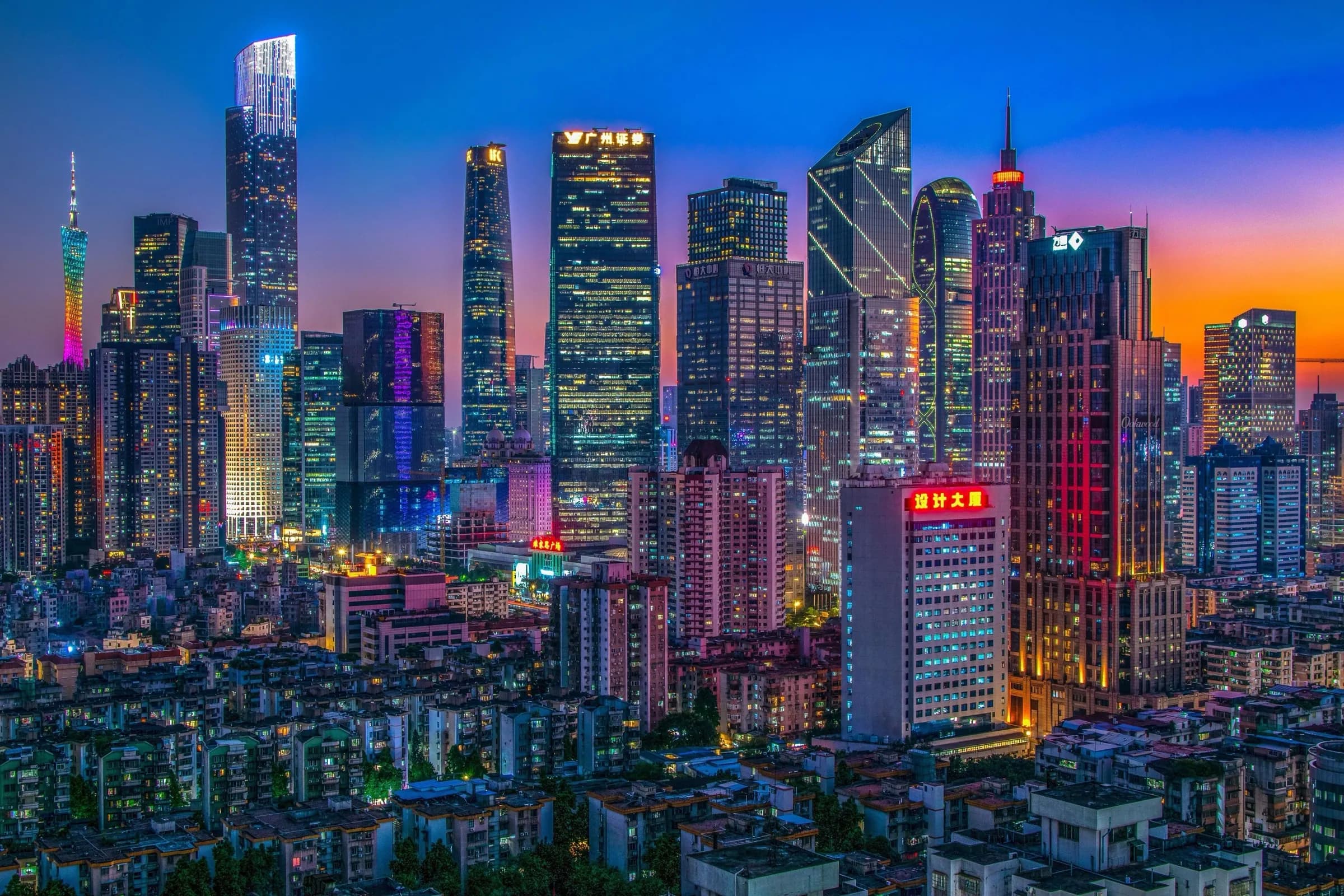 Guangzhou skyline at dusk with illuminated skyscrapers